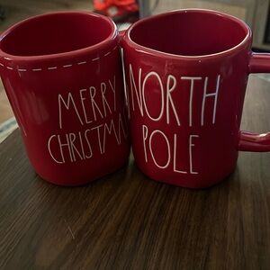 Duo set Rae Dunn red holiday mugs. Merry Christmas and North Pole.